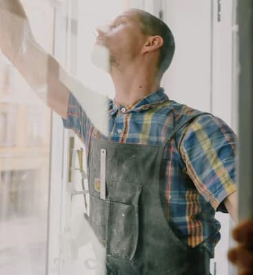 Man installing window